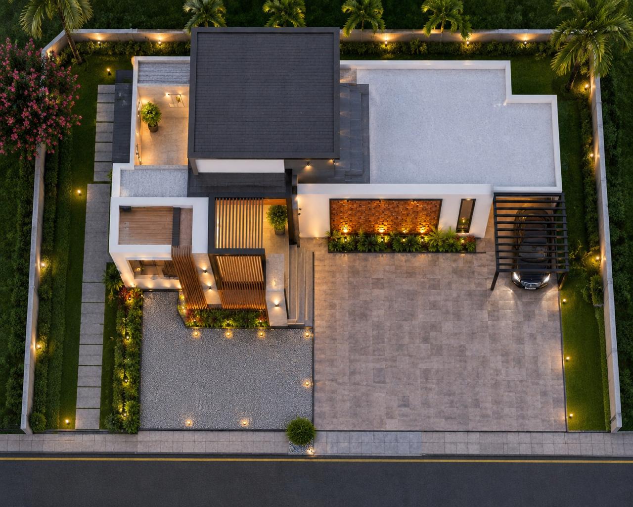 Aerial top view of a modern iptnirman residence at dusk showing landscaped compound, driveway and carport